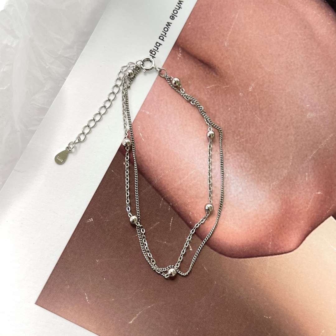 [Revel Jewelry]Zartes Perlenarmband mit doppelter Lage